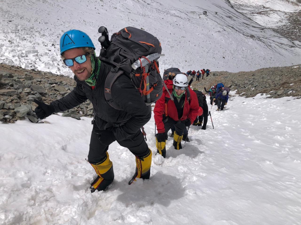 Climbers encounter snow as they carry loads to Camp 1 from Plaza Argentina Base Camp, Aconcagua.