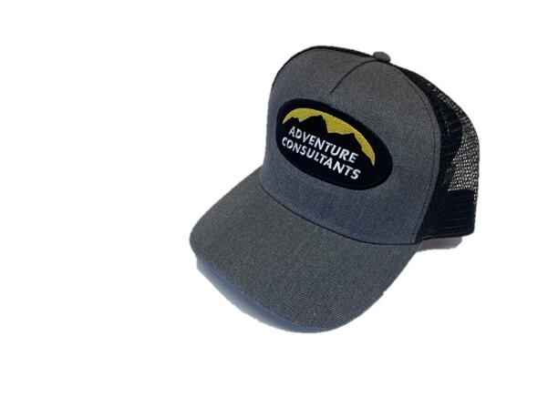Image of the Adventure Consultants branded charcoal grey Trucker cap with logo