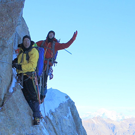 Two climbers negotiating a rocky section on Gran Paradiso