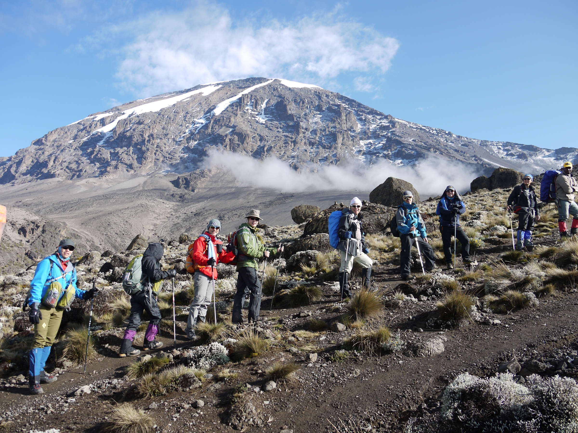Climbers take a break climbing up through the moorland on Mt Kilimanjaro.