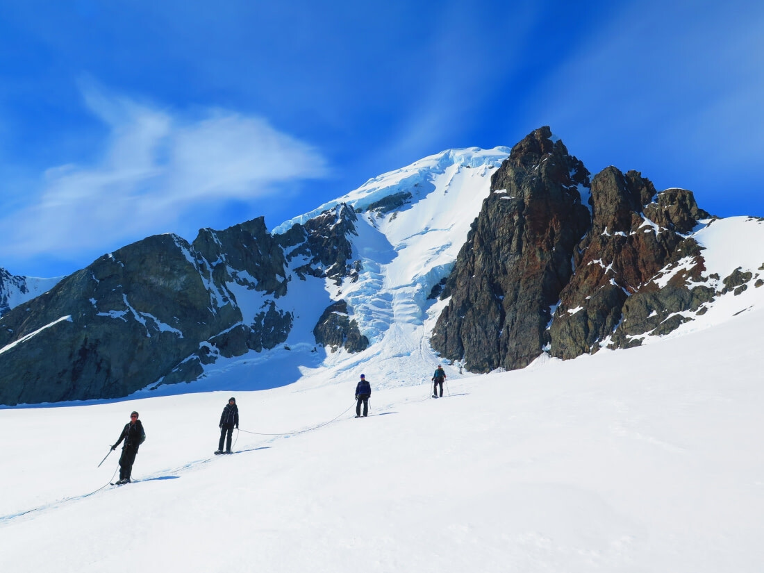 Climbers descend from a peak on the Antarctic Peninsula