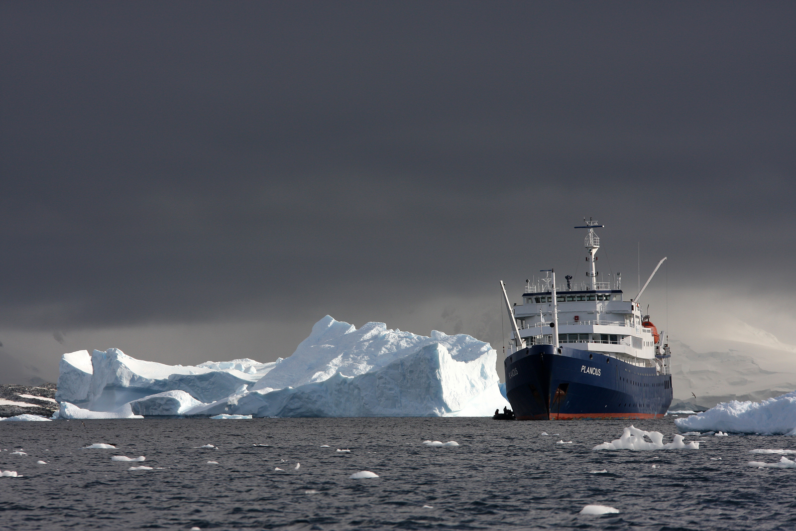 A storm brews with moody skies as the M/V Plancius cruises towards shelter on the Antarctic Peninsula