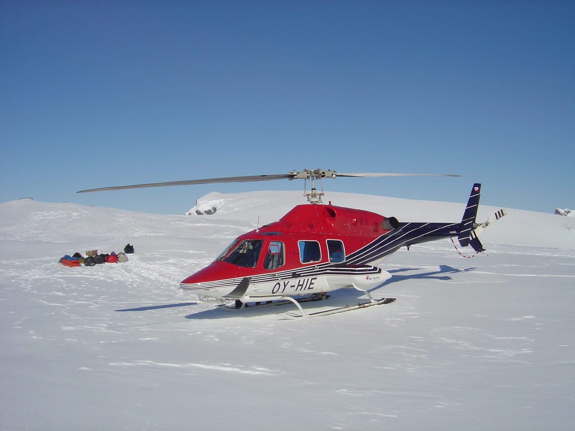 The expedition gets underway with a helicopter drop off onto the Greenland polar plateau