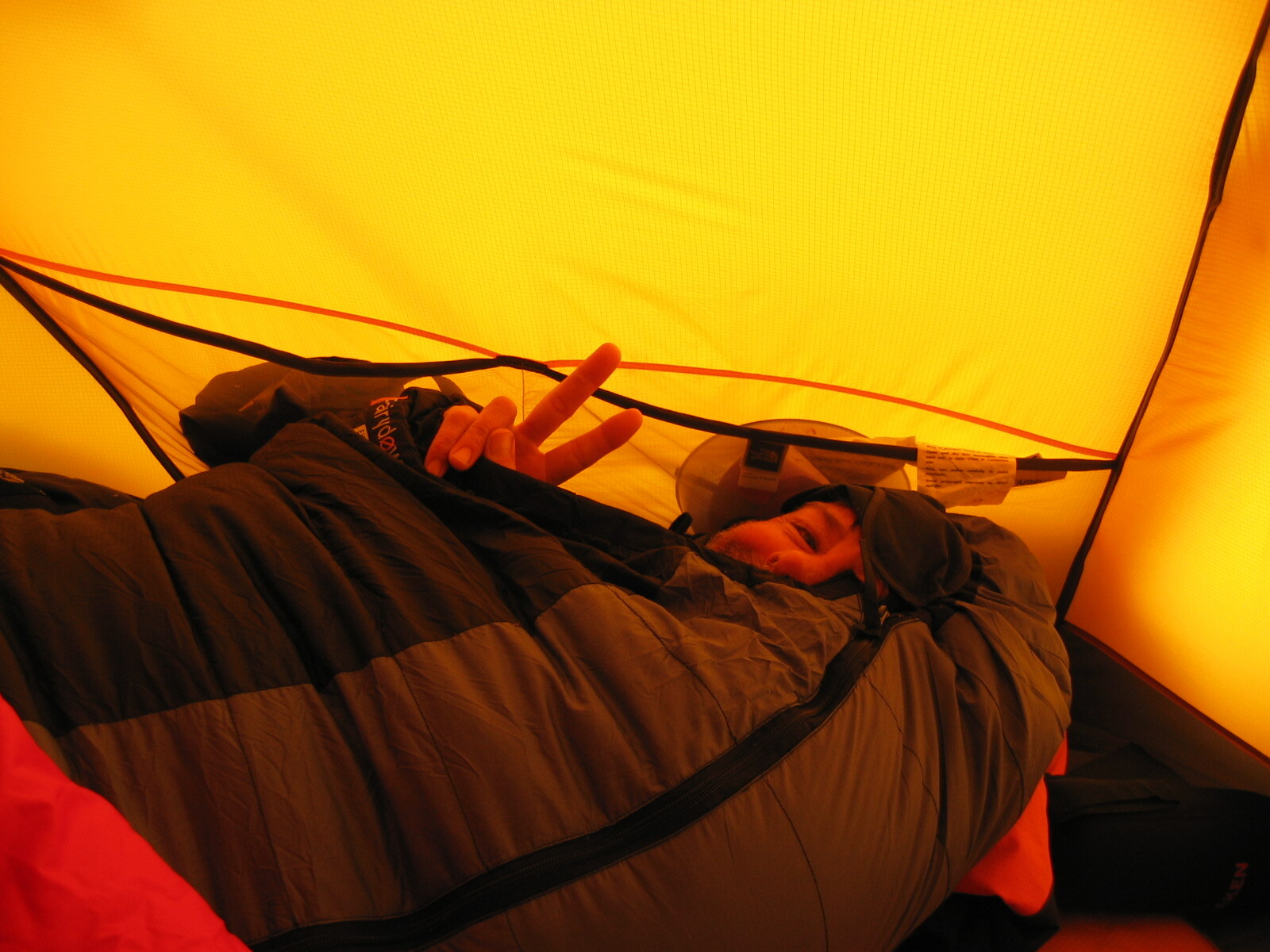 Cosy in the sleeping bag after a day of sled hauling