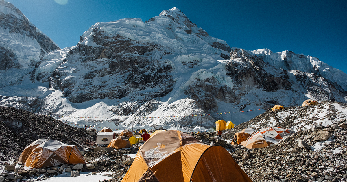 The AC tents at Everest Base Camp positioned alongside the Khumbu Icefall and under the shadow of Mount Nuptse.