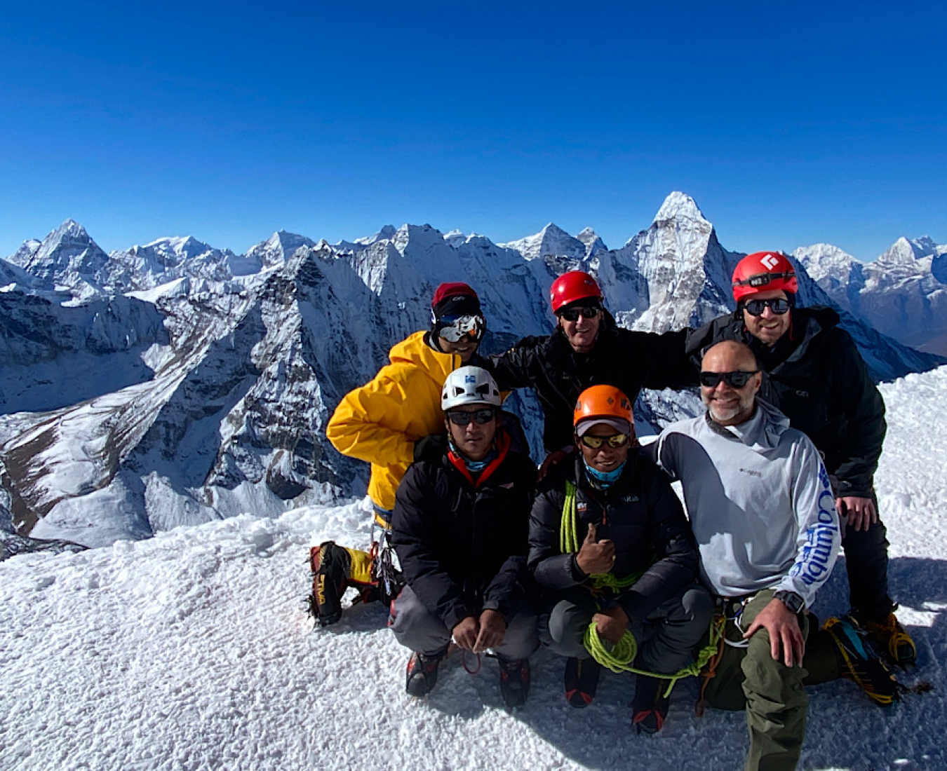 The Island Peak 2024 #2 team all smiles on the summit of Island Peak on a stunning clear post monsoon day.