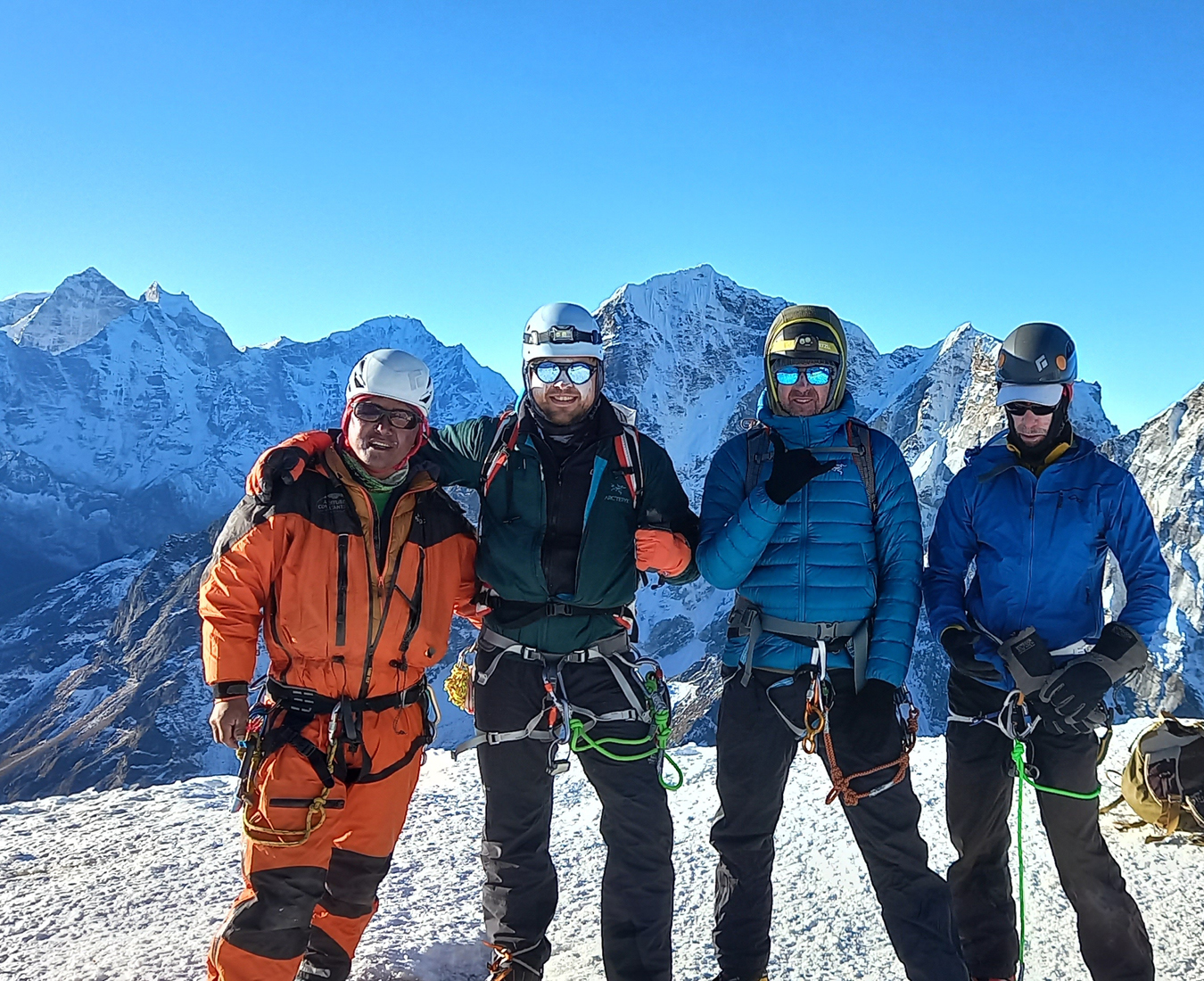 The Three Peaks Nepal expedition team stand on the summit of their first peak, Lobuche East in near perfect conditions.