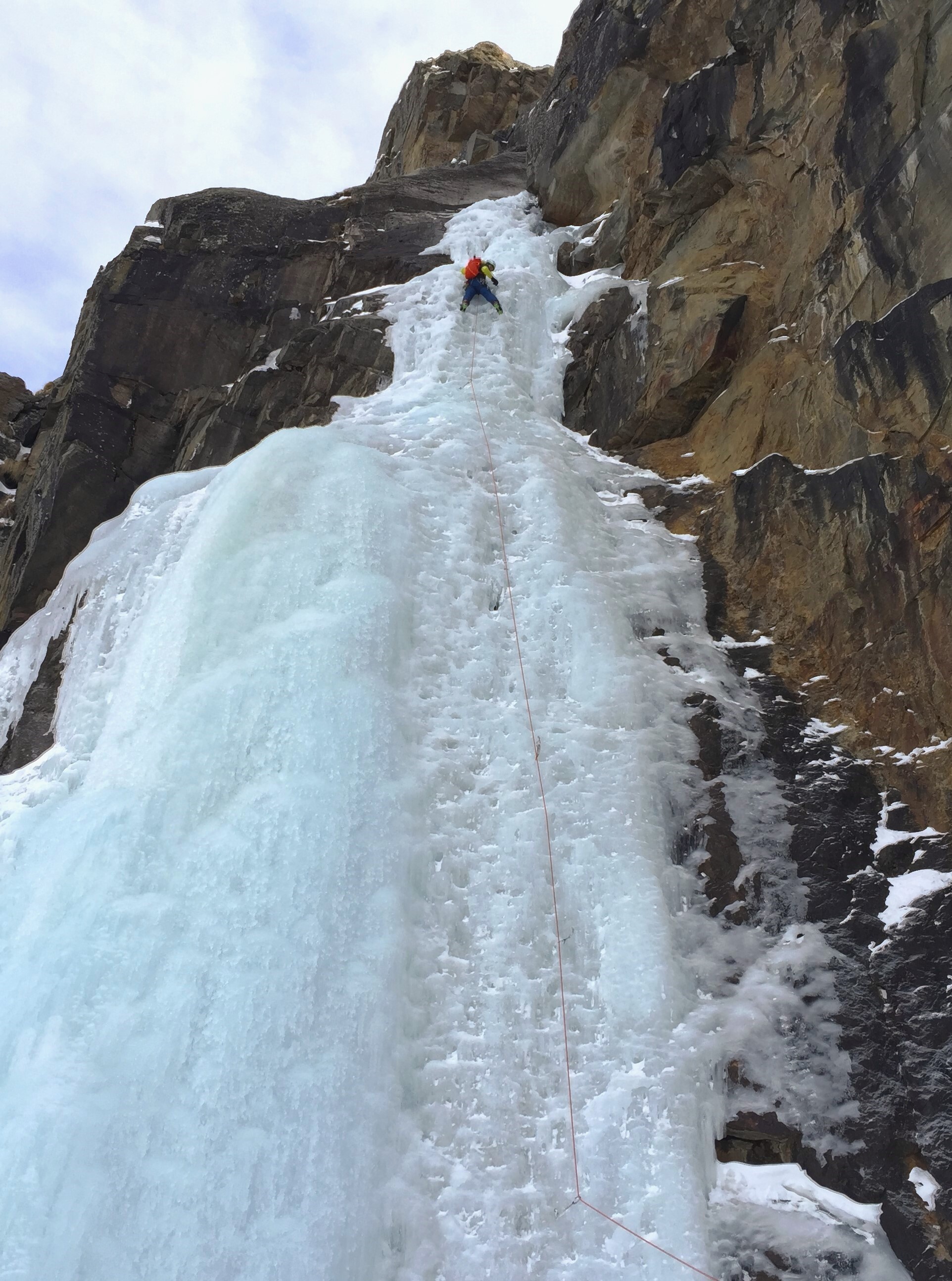 Ice climber leading a pitch in Cogne