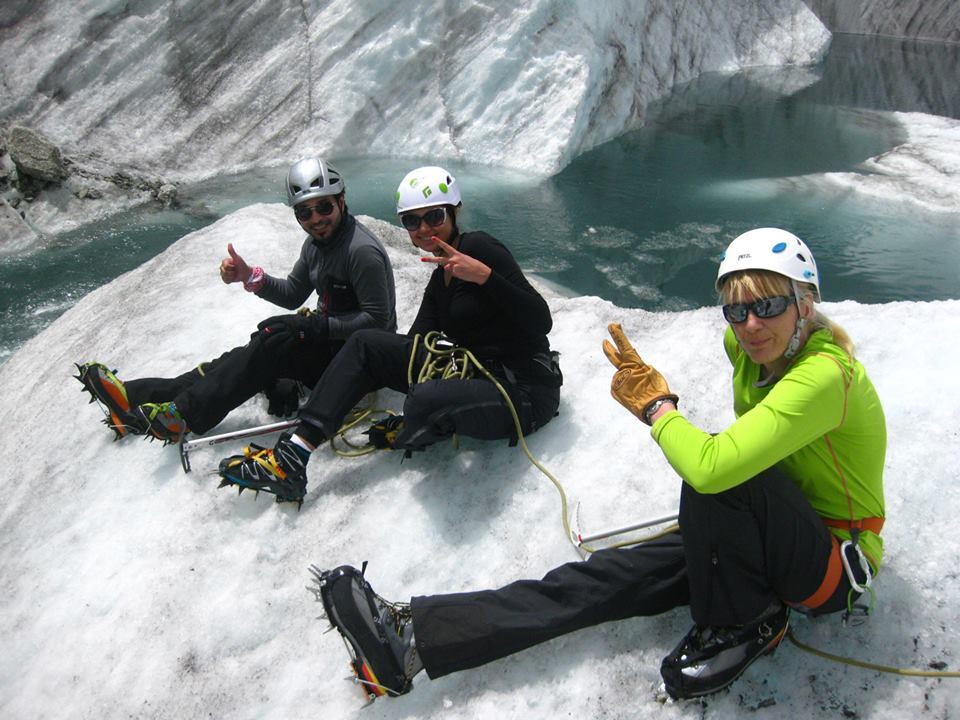 Climbers take a moment to rest while learning hard ice skills on the Mer de Glace