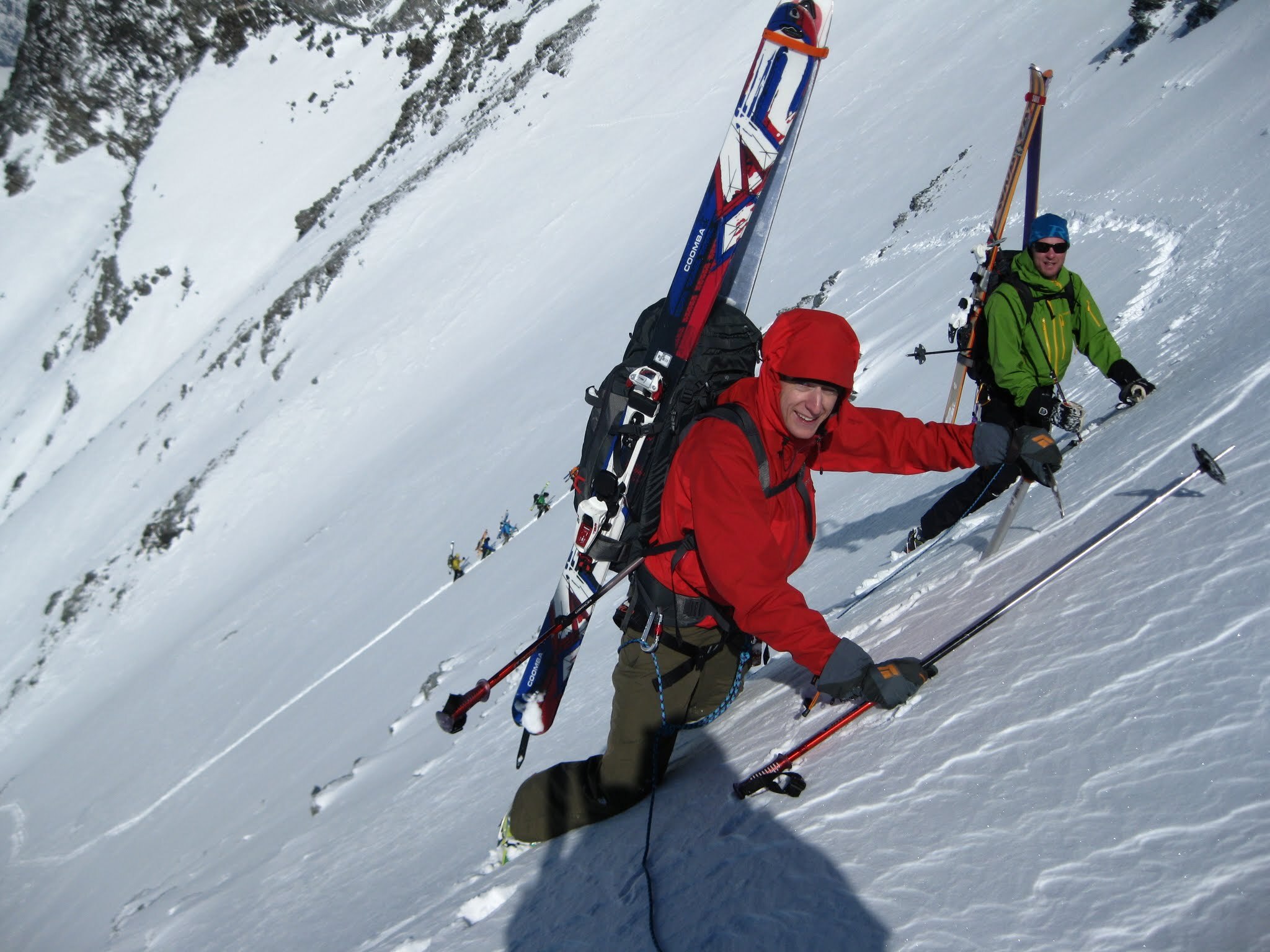 Two backcountry skiers ascend a steep slope on the classic Europe Haute Route ski tour.