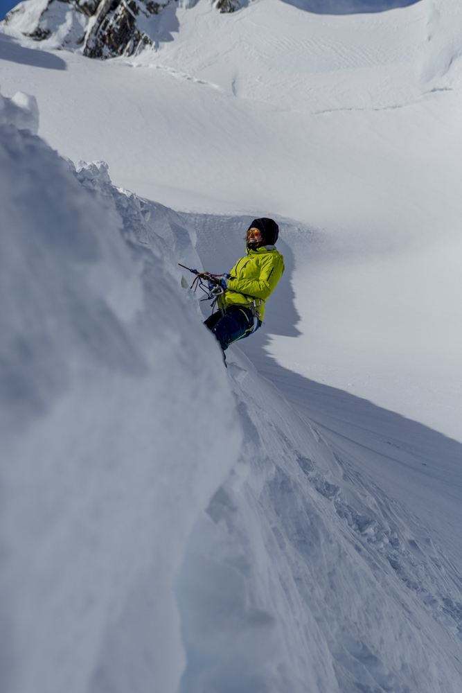 A skier practices extracting themselves from a crevasse using snow anchors, an important skill to learn for polar travel.