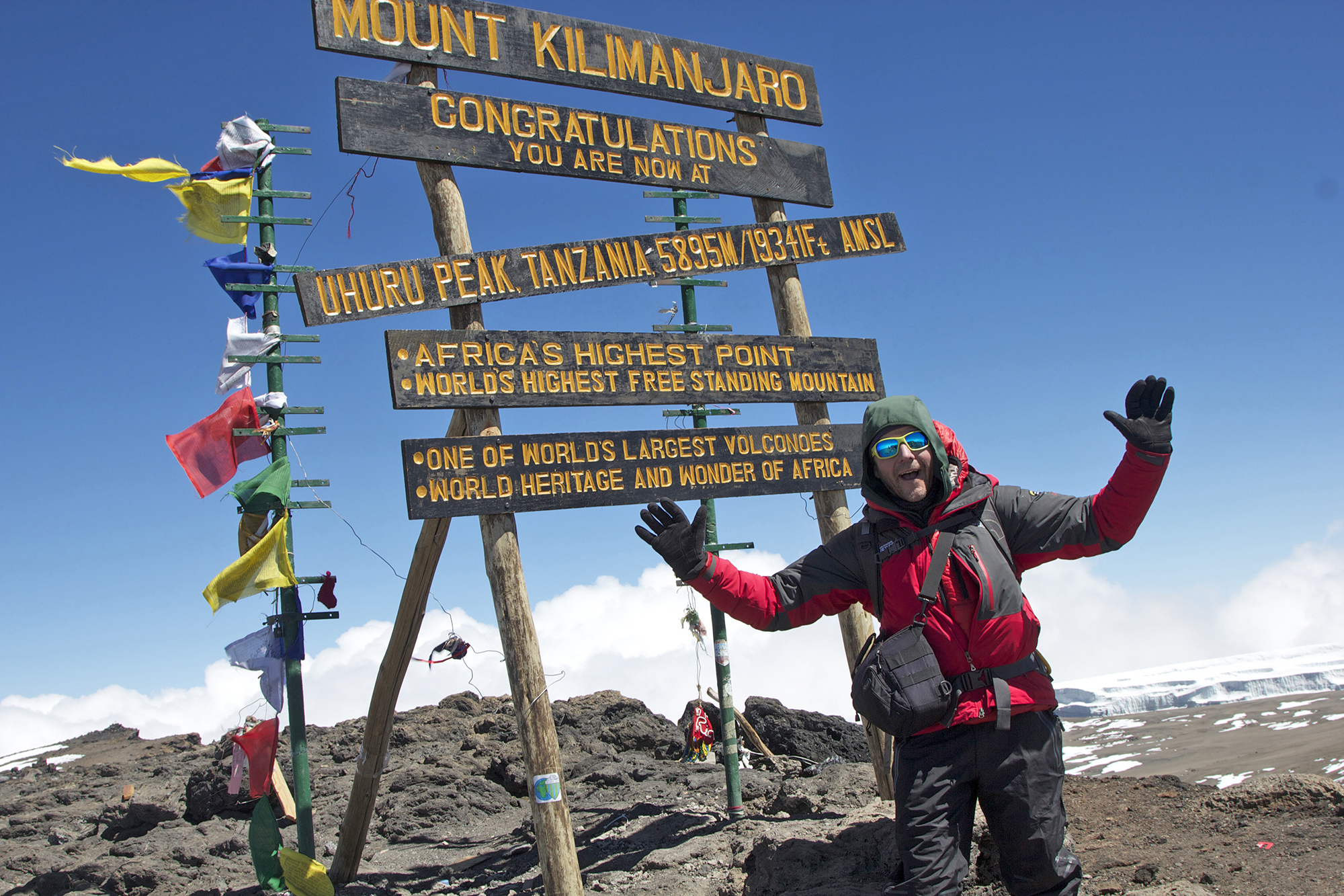 IFMGA Mountain & Ski Guide Dean Staples on the summit of Mount Kilimanjaro, Africa.