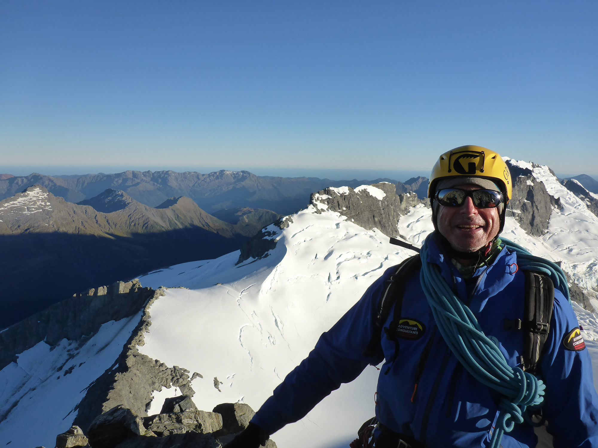 AC Guide Mike Roberts on the summit of New Zealand's Mount Aspiring.