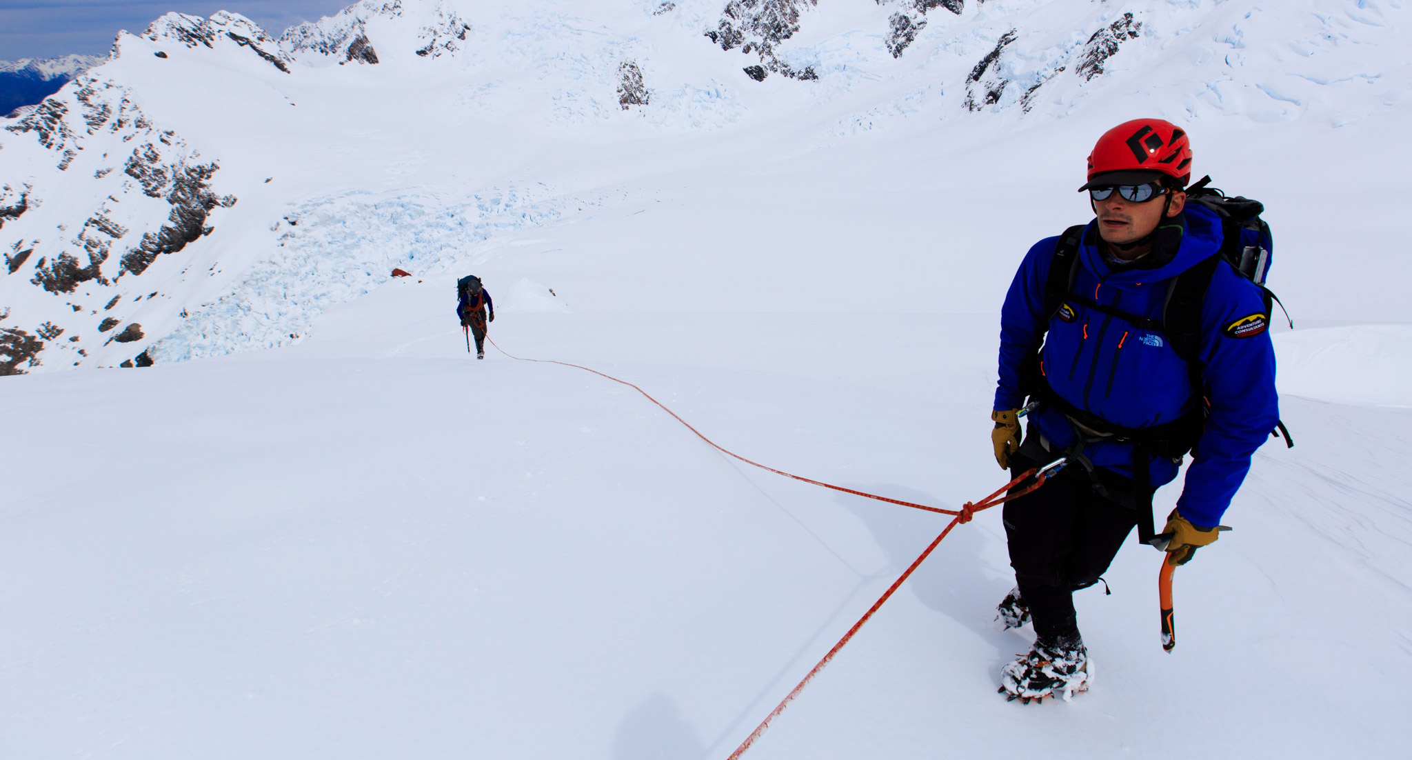 A guide moves in a rope team high above Plateau Hut, New Zealand.