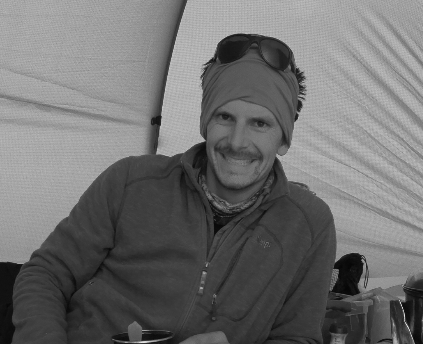 Meet AC IFMGA Mountain & Ski Guide, JB Chandesris pictured inside the kitchen tent on Mount Vinson in Antarctica.