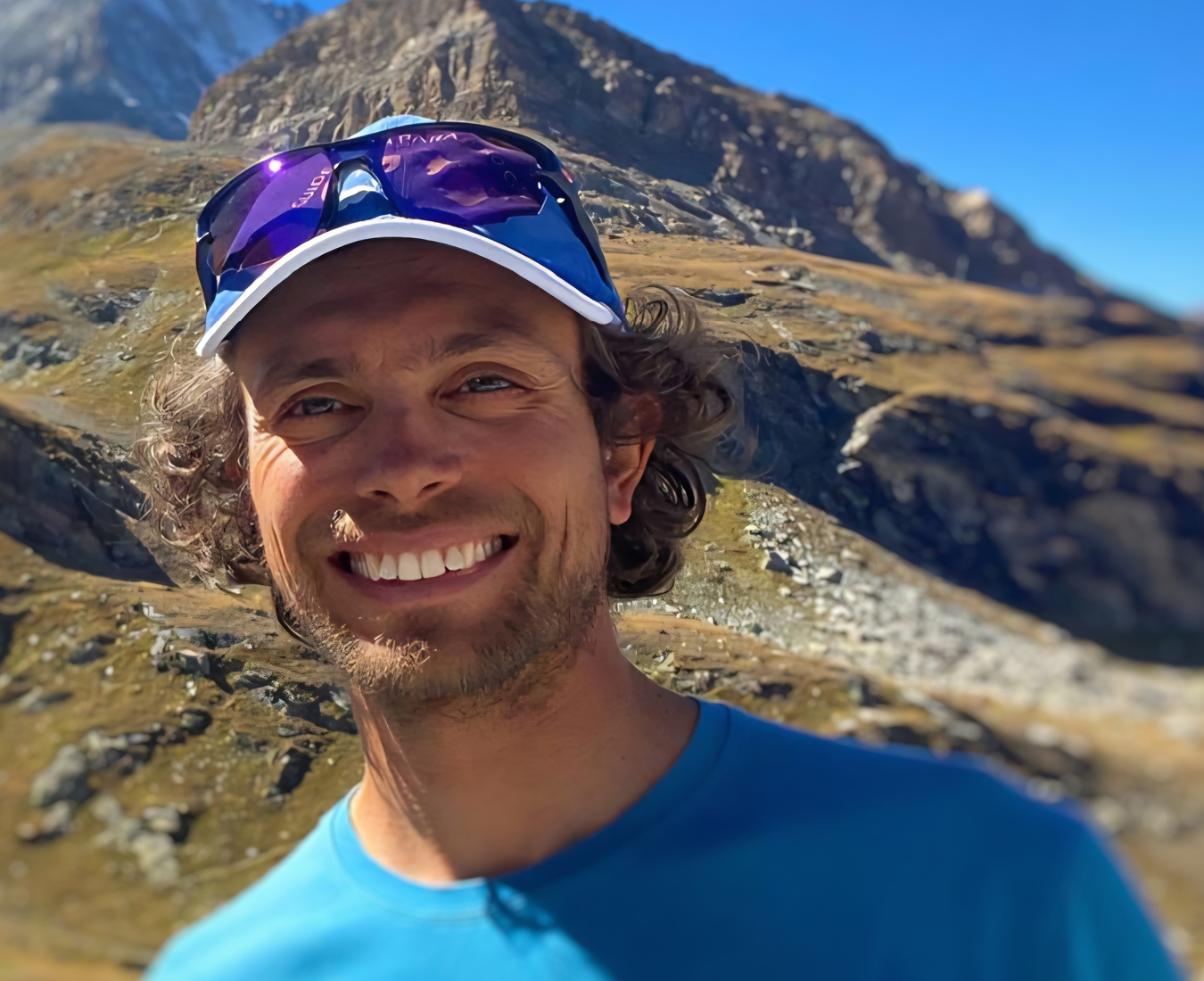 Adventure Consultants IFMGA Climbing & Ski Guide Luigi Zignone smiles widely for the camera.