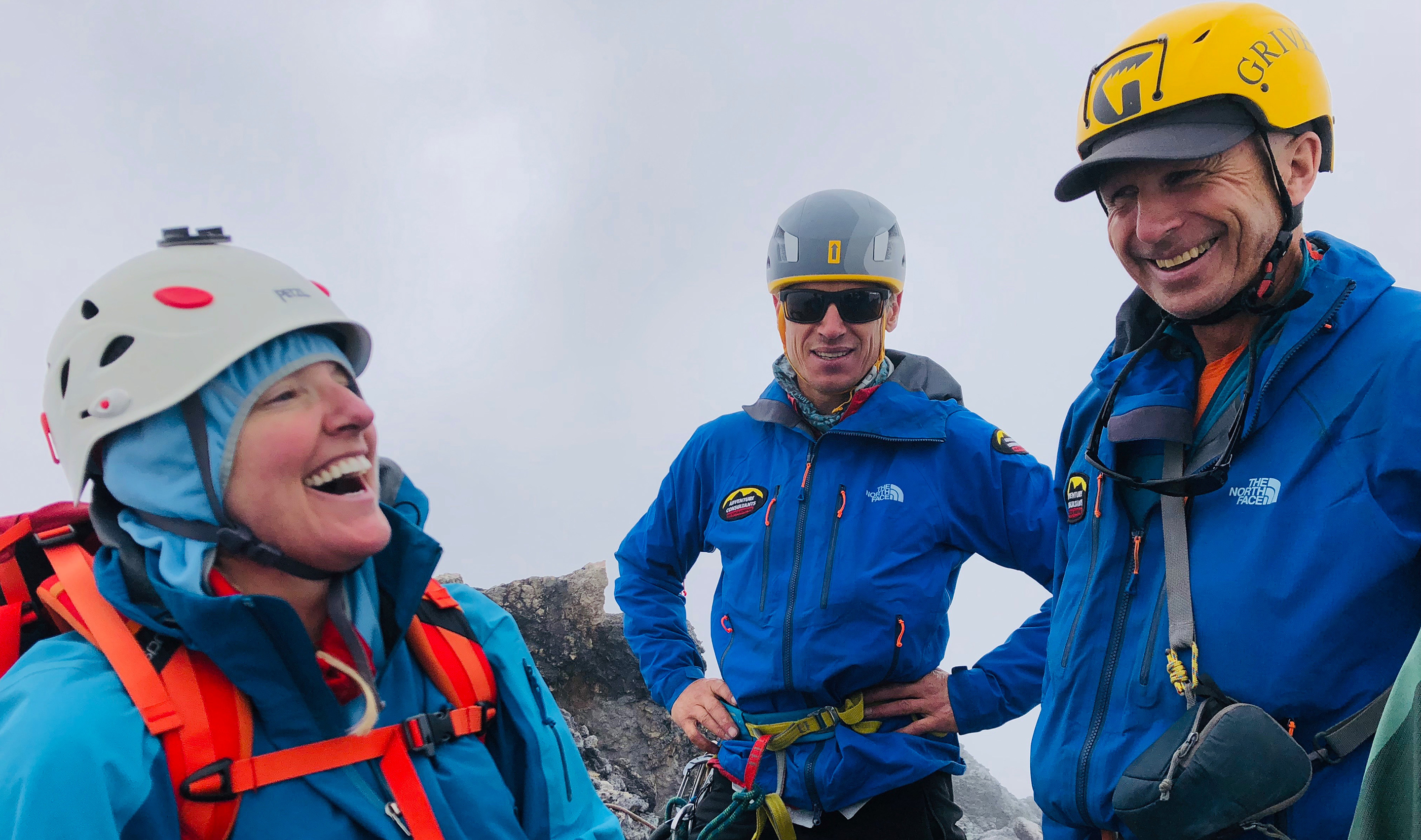 Mike Roberts with fellow AC Guide Steve Moffat and a client on the summit of Carstensz Pyramid, wide smiles as they celebrate!