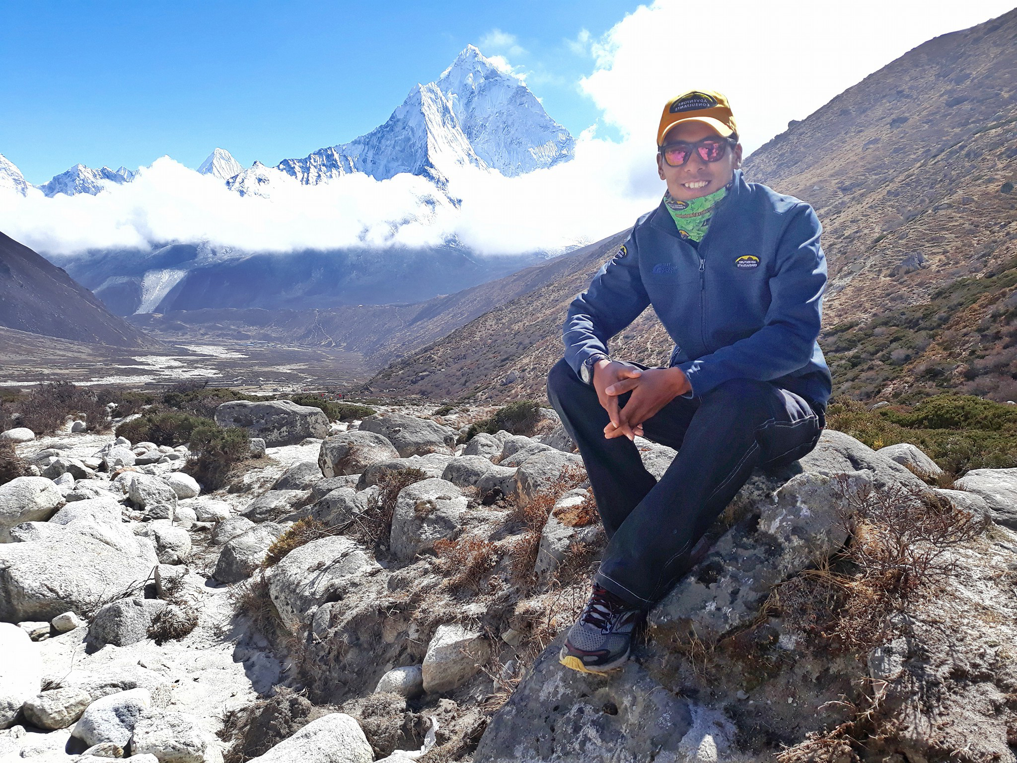 AC Trekking and Climbing Sherpa, Kunga Sherpa with Mount Ama Dablam behind.