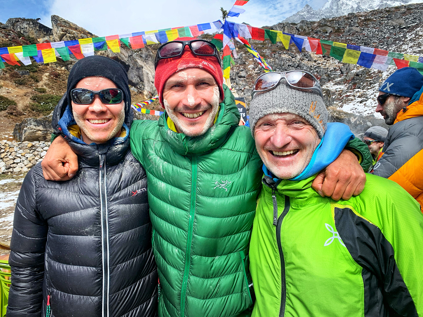 AC create a team camaraderie, evident here as these climbers participate in their Puja ceremony prior to making their summit attempt.