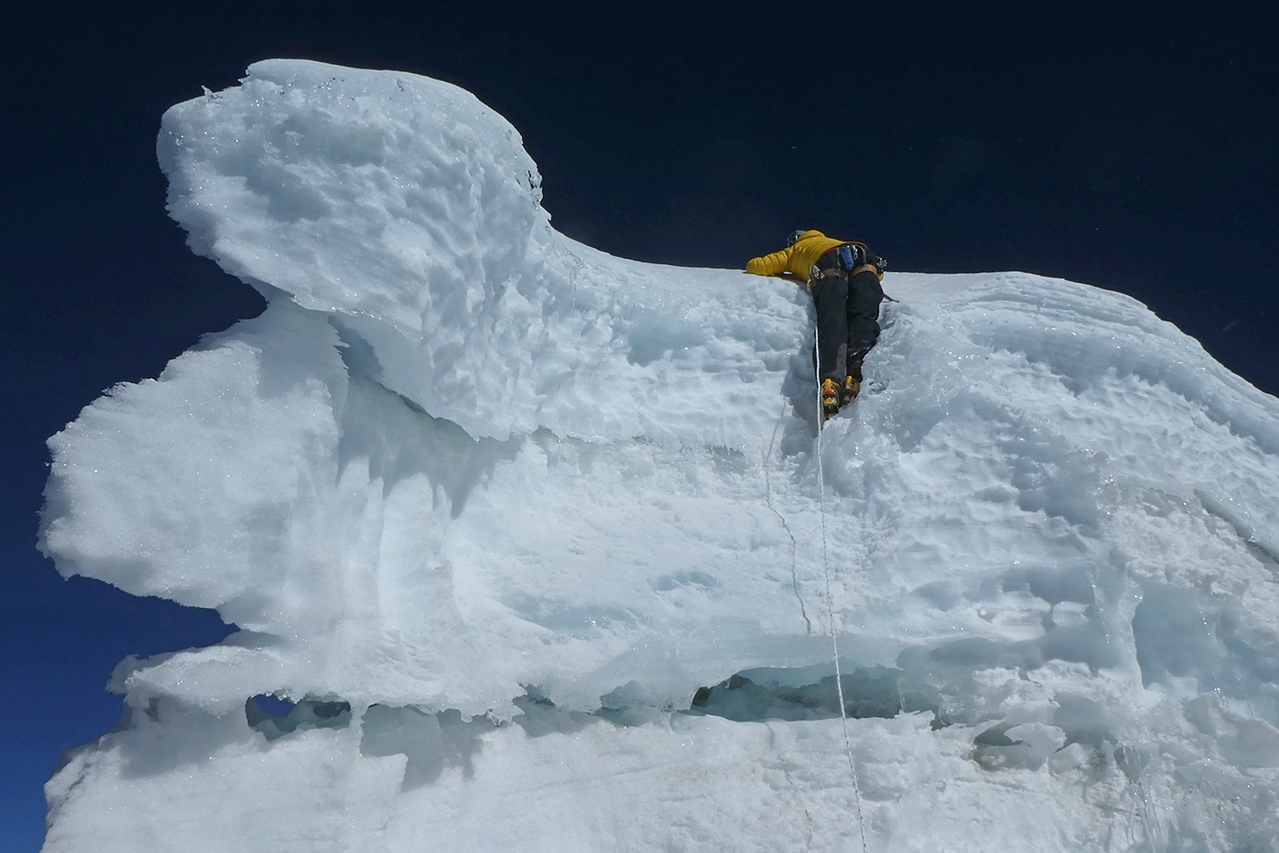 Climbing an icy overhang on Cholatse