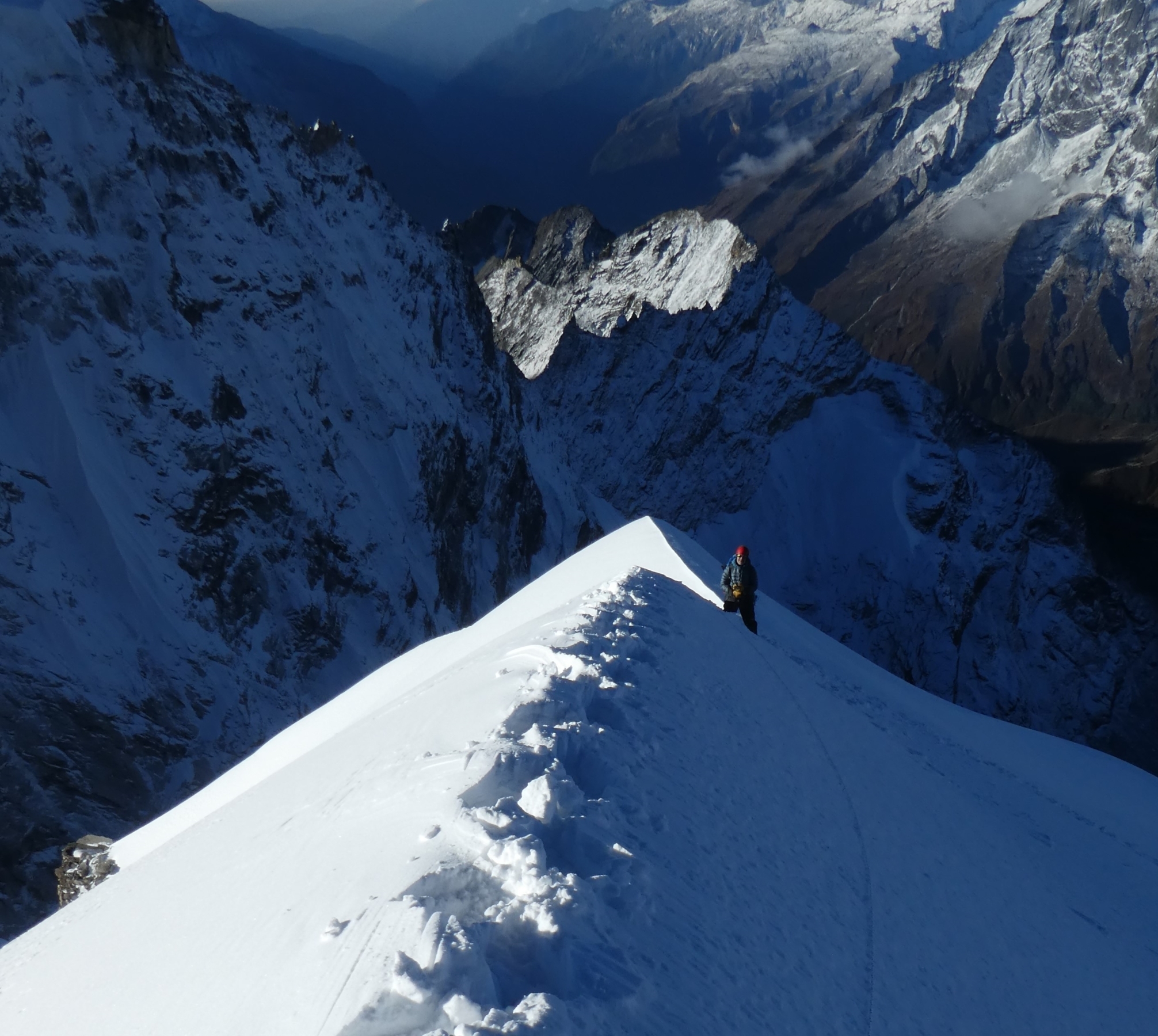 Looking down the snowy ridge on the upper slopes of Cholatse