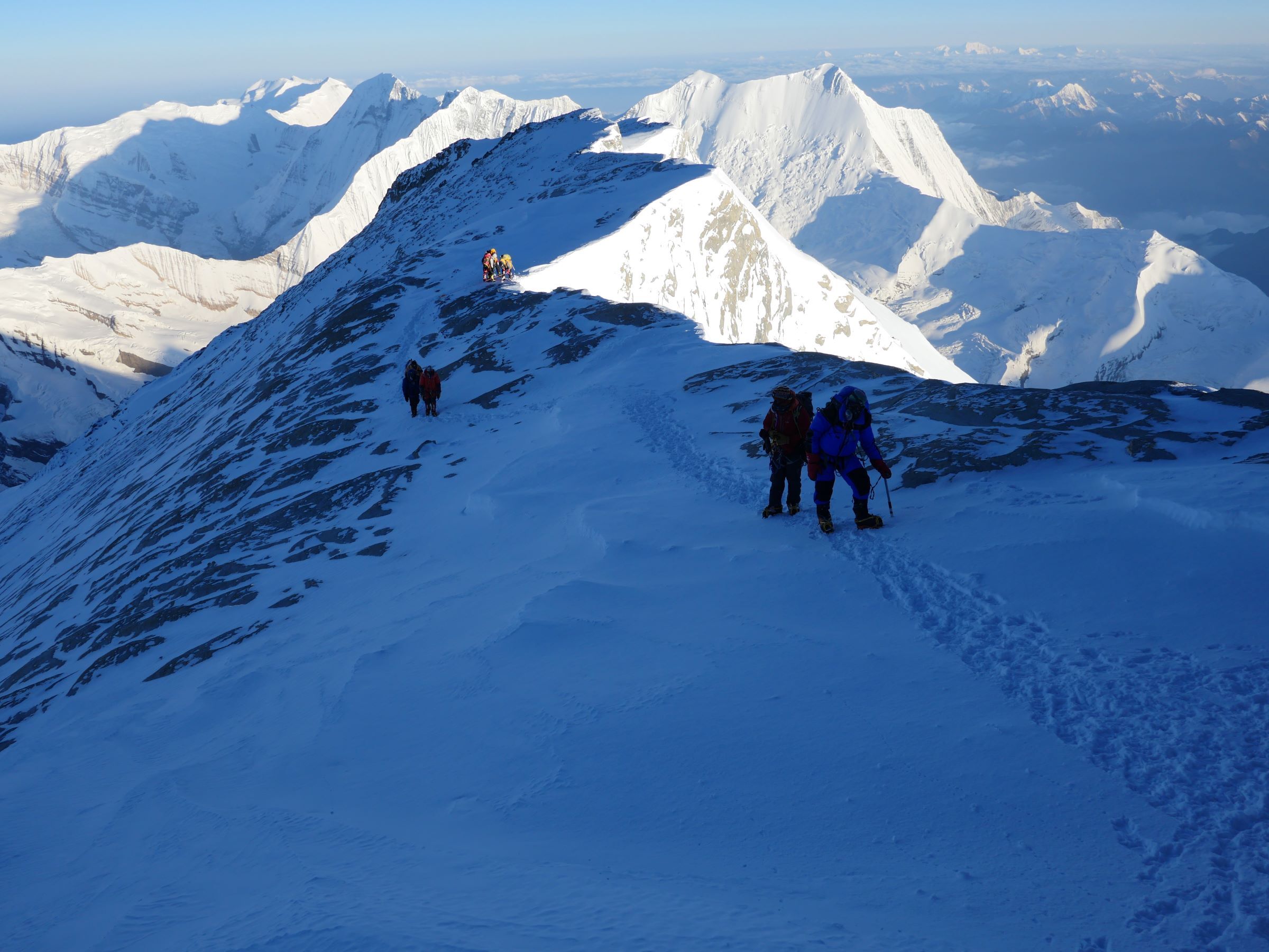 Climbers close to summit of Dhaulagiri at dawn