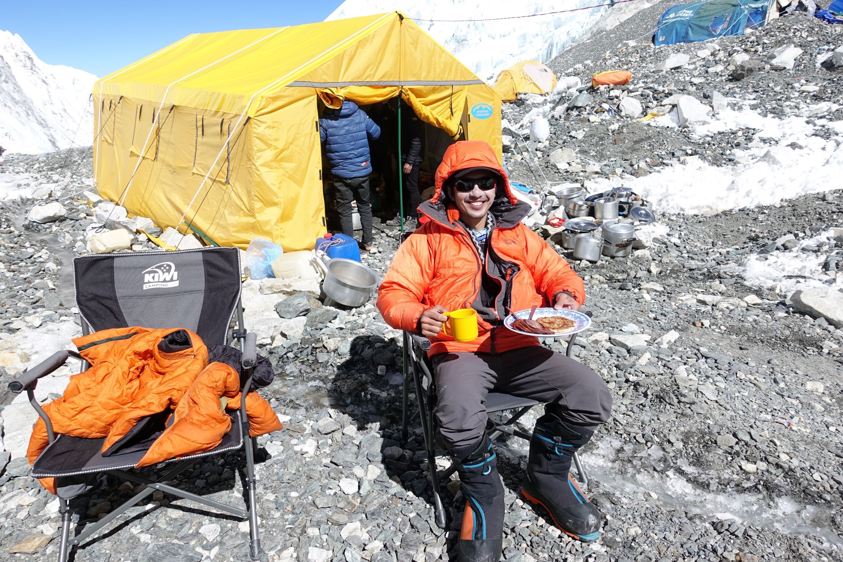 Private climber enjoys a leisurely breakfast at Camp 2 on Mt Everest
