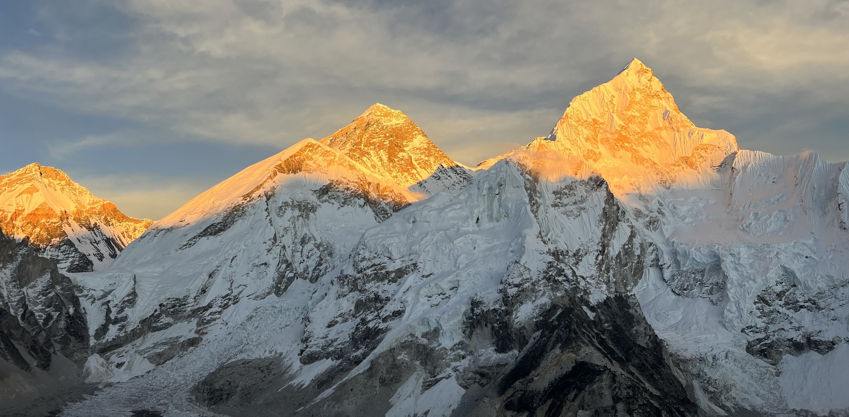 Everest and Nuptse glow at sunset as seen from Kala Patar