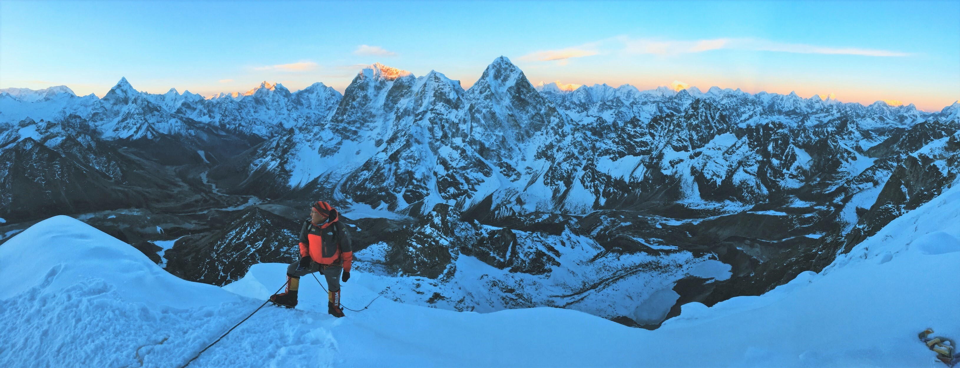 The peaks of the Himalaya lit up at dawn on Lobuche summit day