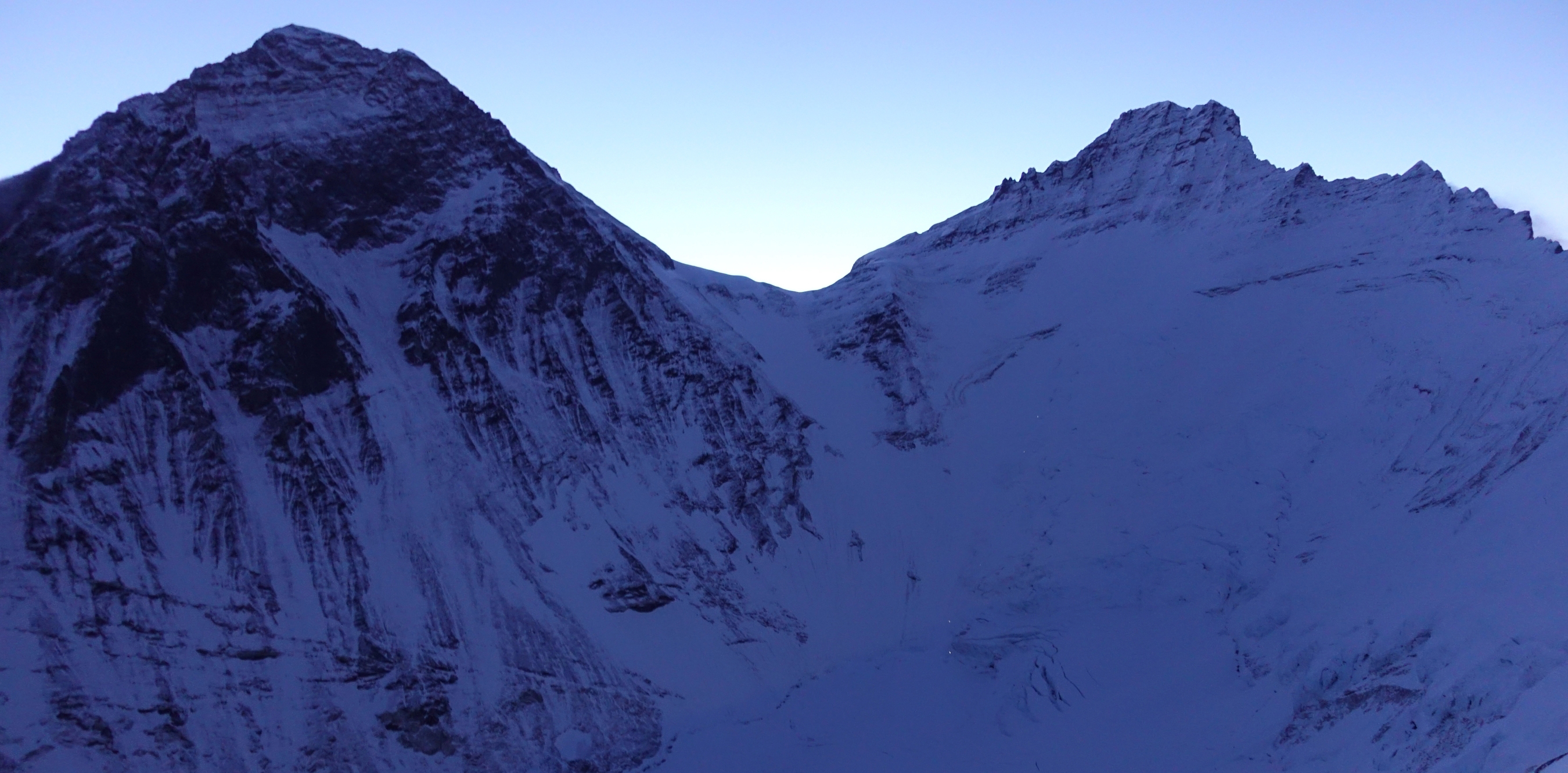 Mounts Everest and Lhotse in the dark shadows of dawn.