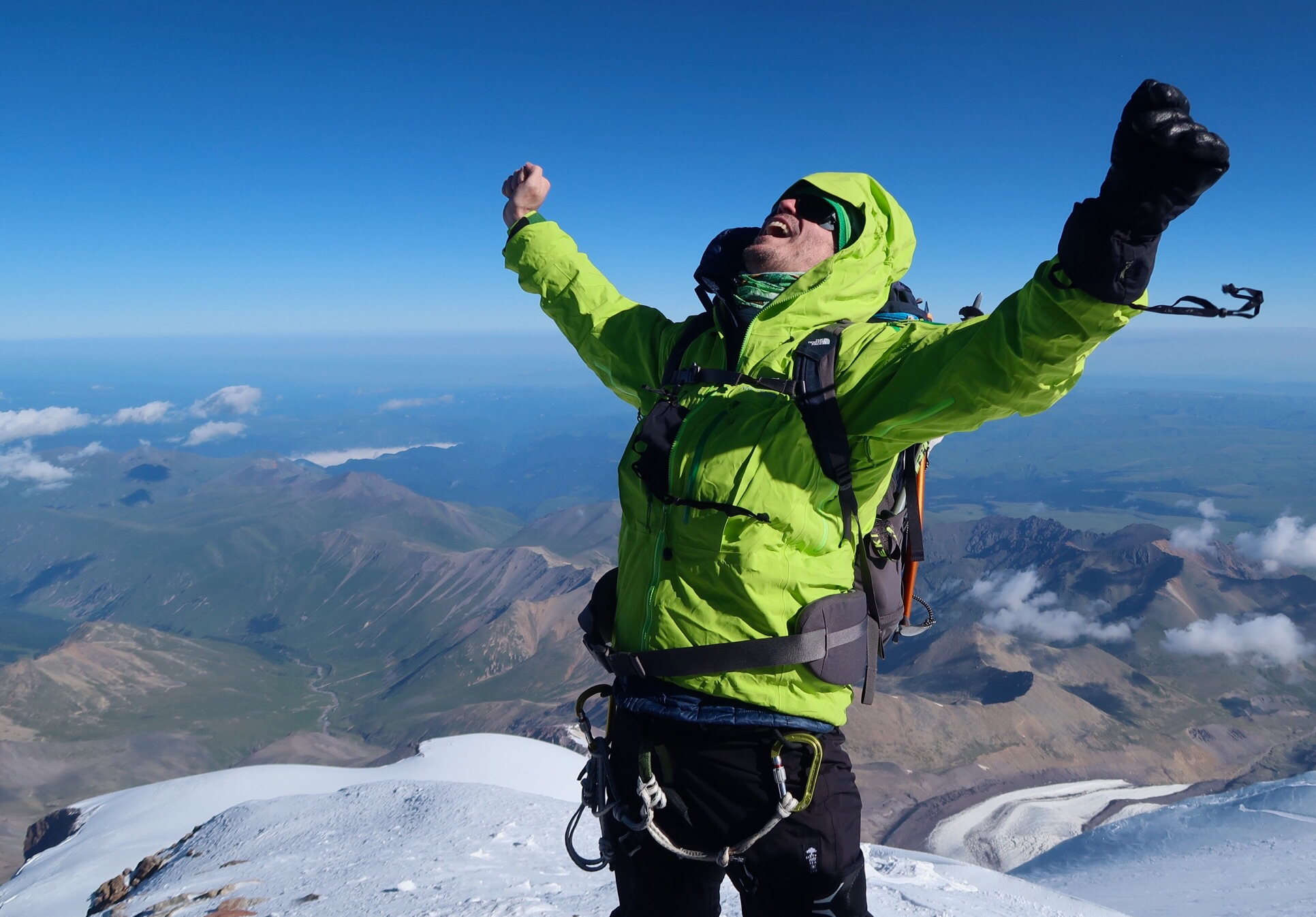 Trent Thorne celebrates on the summit of Mount Elbrus, Russia, the highest peak in continental Europe.