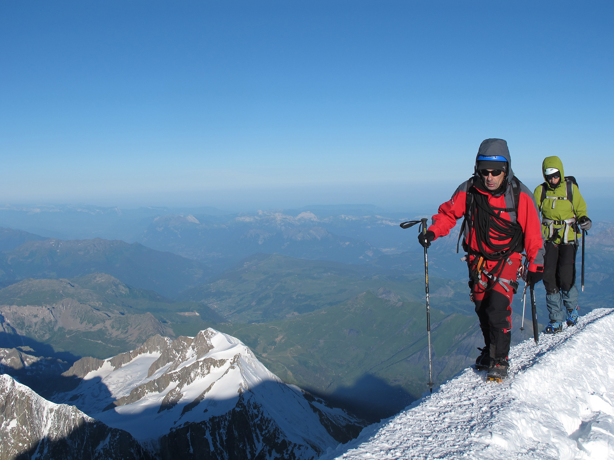 Two climbers make their way to the summit of Mont Blanc.