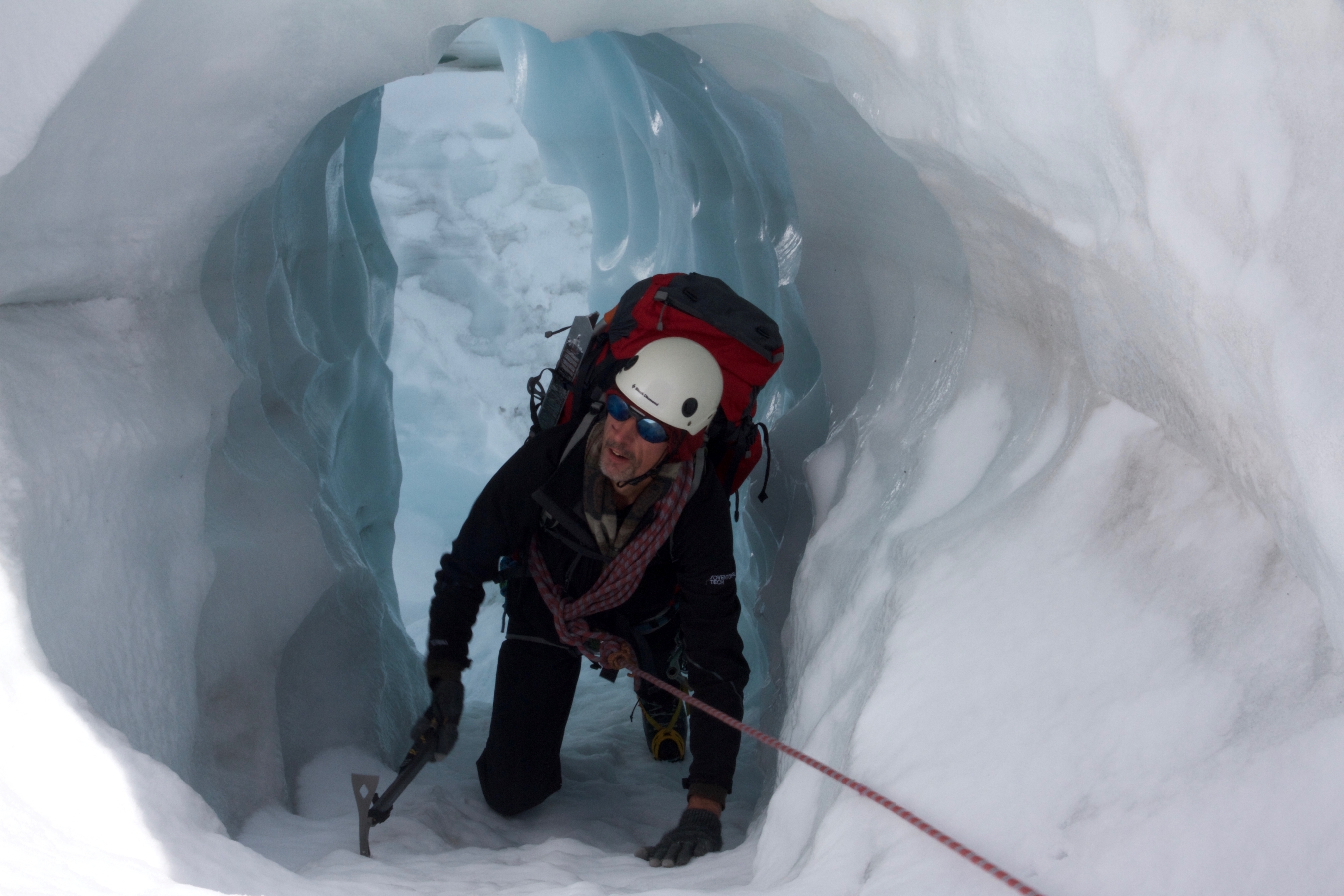Climbing through an ice tunnel