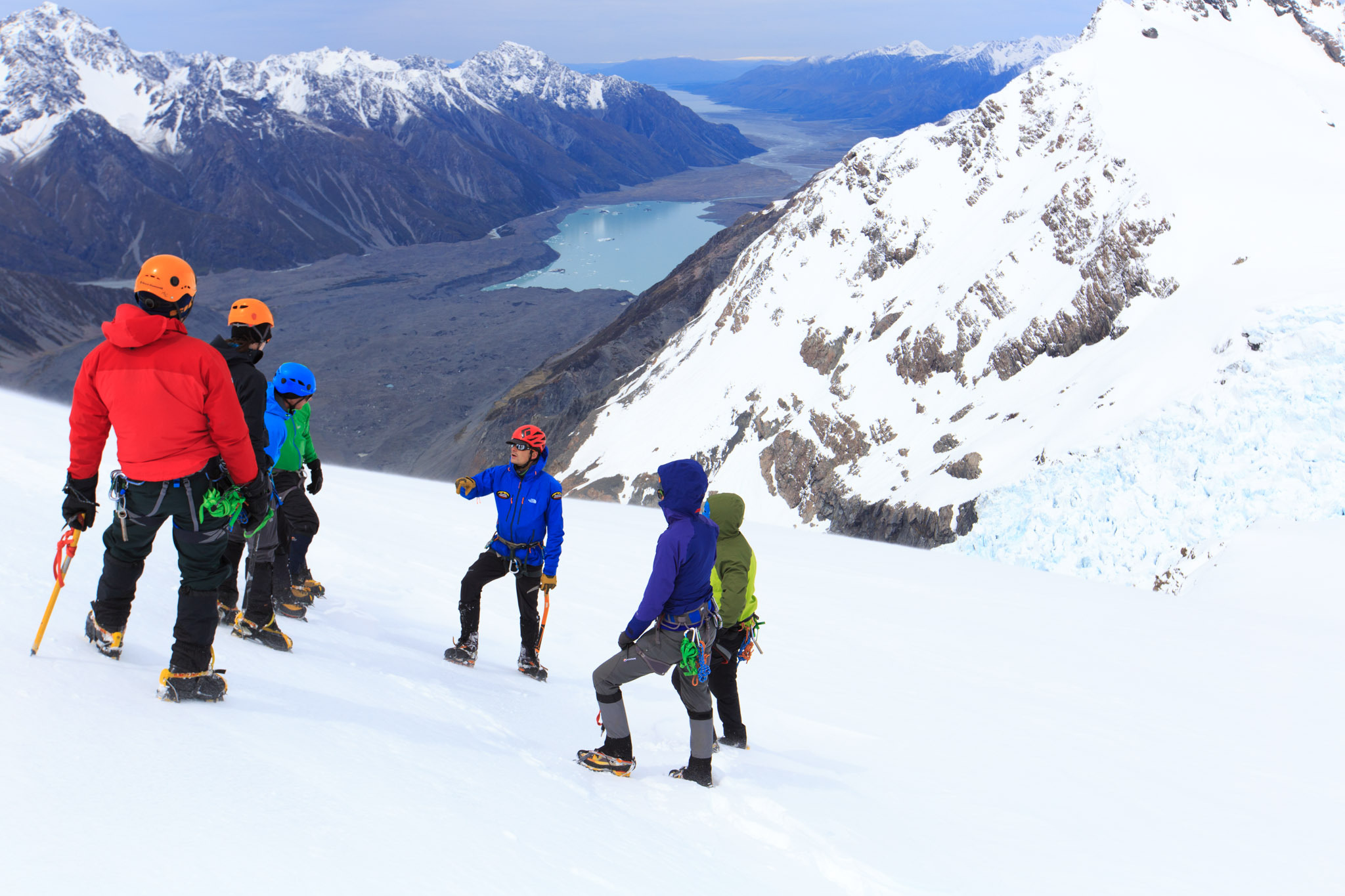 A group of climbers receive instruction from their guide in Aoraki Mount Cook National Park