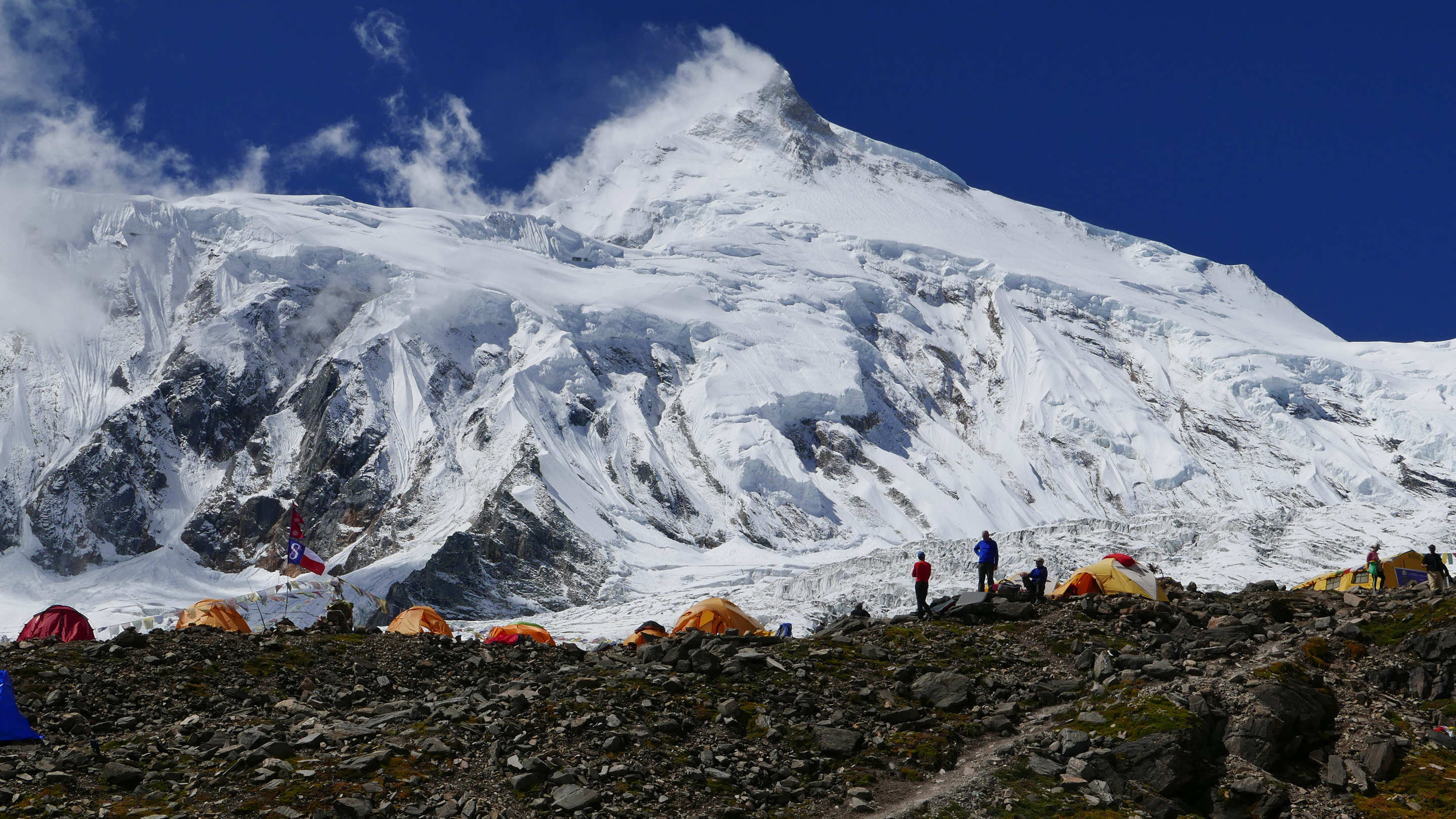 Mount Manaslu Base Camp sitting on glacial moraine below the towering peak.