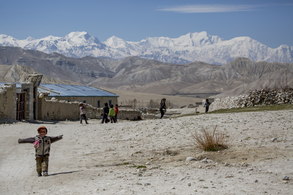 A small boy welcomes trekkers with open arms into his tiny village of Choser (3,916m), the last settlement before Tibet.
