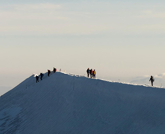 Climbers traversing a ridge nearby Mont Blanc