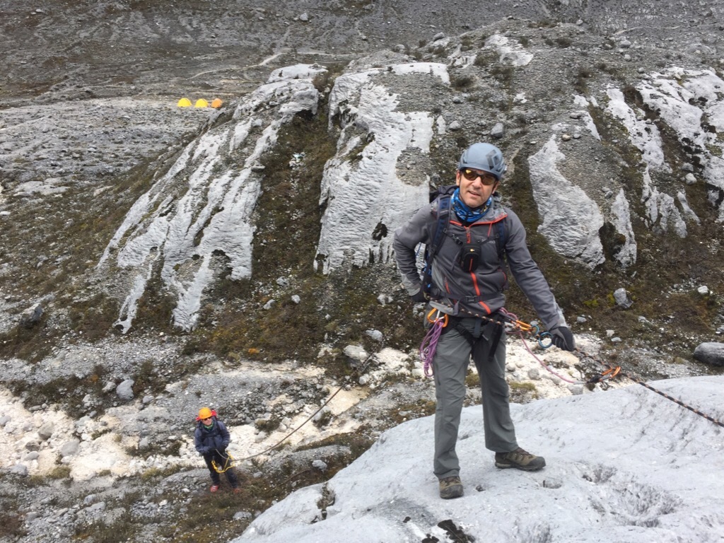 Climbers practice rappelling ahead of their climb of Seven Summits peak Carstensz Pyramid with Adventure Consultants