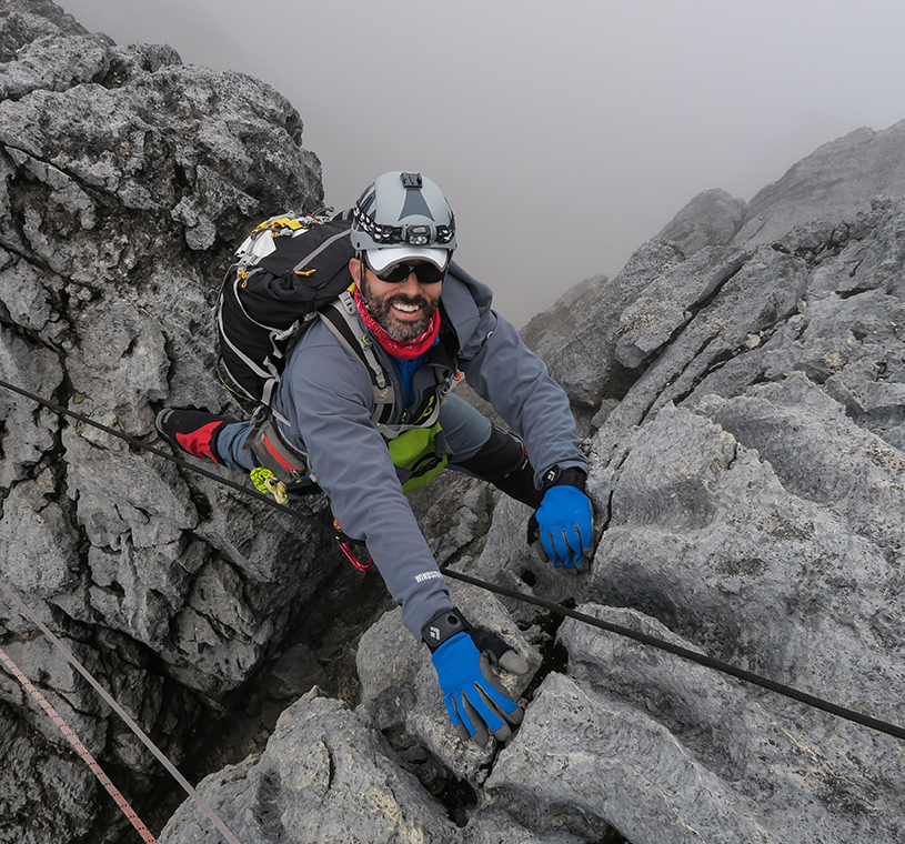 A climber negotiates the limestone slabs on Carstensz Pyramid