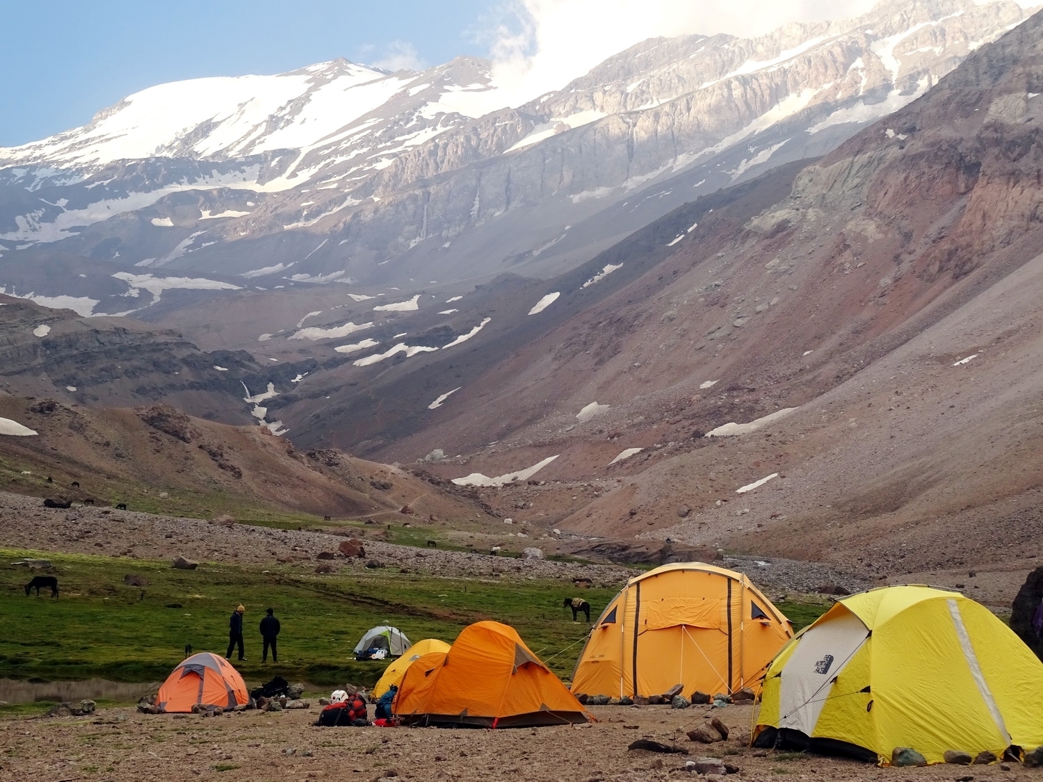 yellow tents brighten the landscape at Camp 1 Piedra Numerada