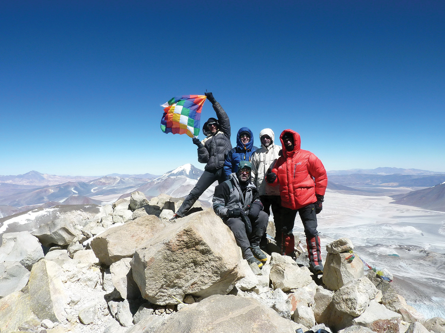 A team on the summit of Ojos del Salado
